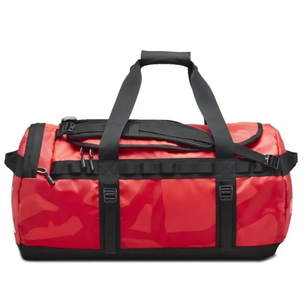 NWT 2022 KAWS x THE NORTH FACE MEDIUM RED DUFFLE BAG BRILLIANT CORAL 86 PRINT
